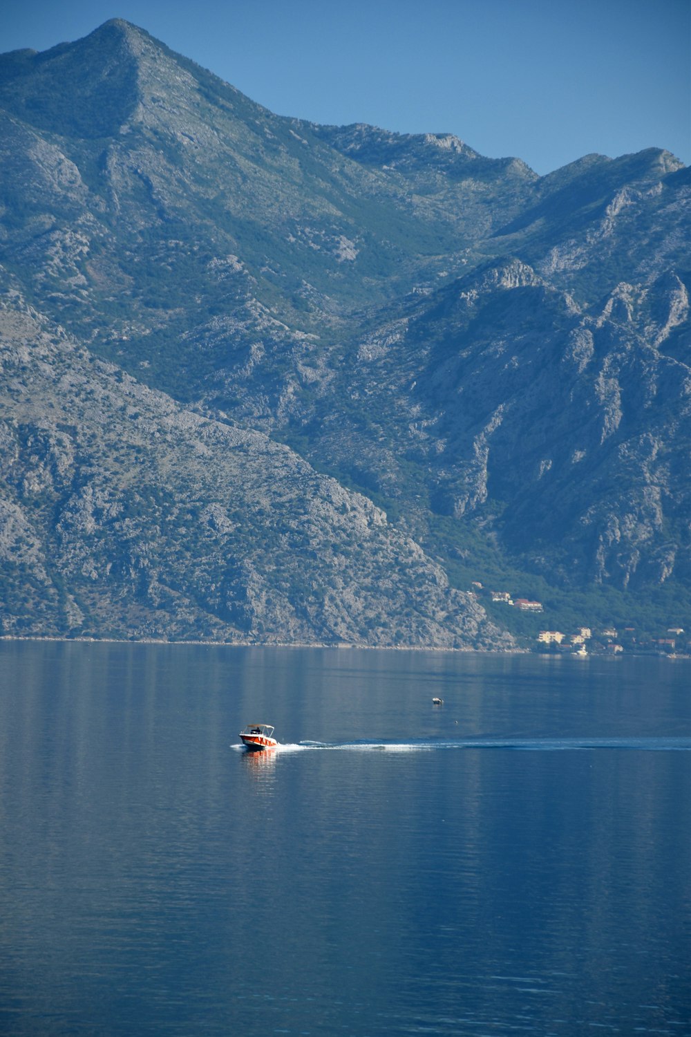 a boat traveling on a large body of water