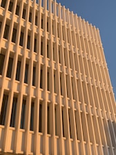 Modern luxury building exterior bathed in soft evening light.
