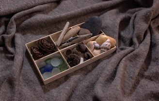 A variety of ecostash boxes stacked neatly, showcasing different styles and sizes in a cozy home setting.