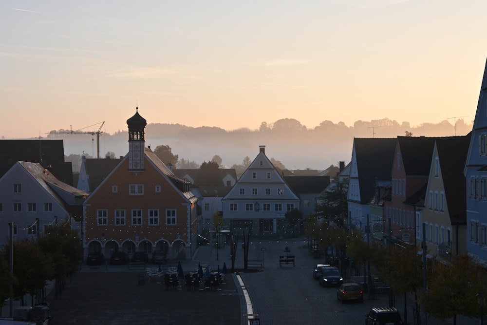 a city street with a clock tower in the distance