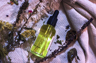 a bottle of perfume sitting on top of a table
