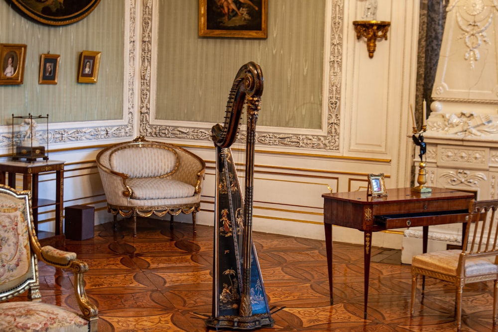 a room filled with furniture and a harp