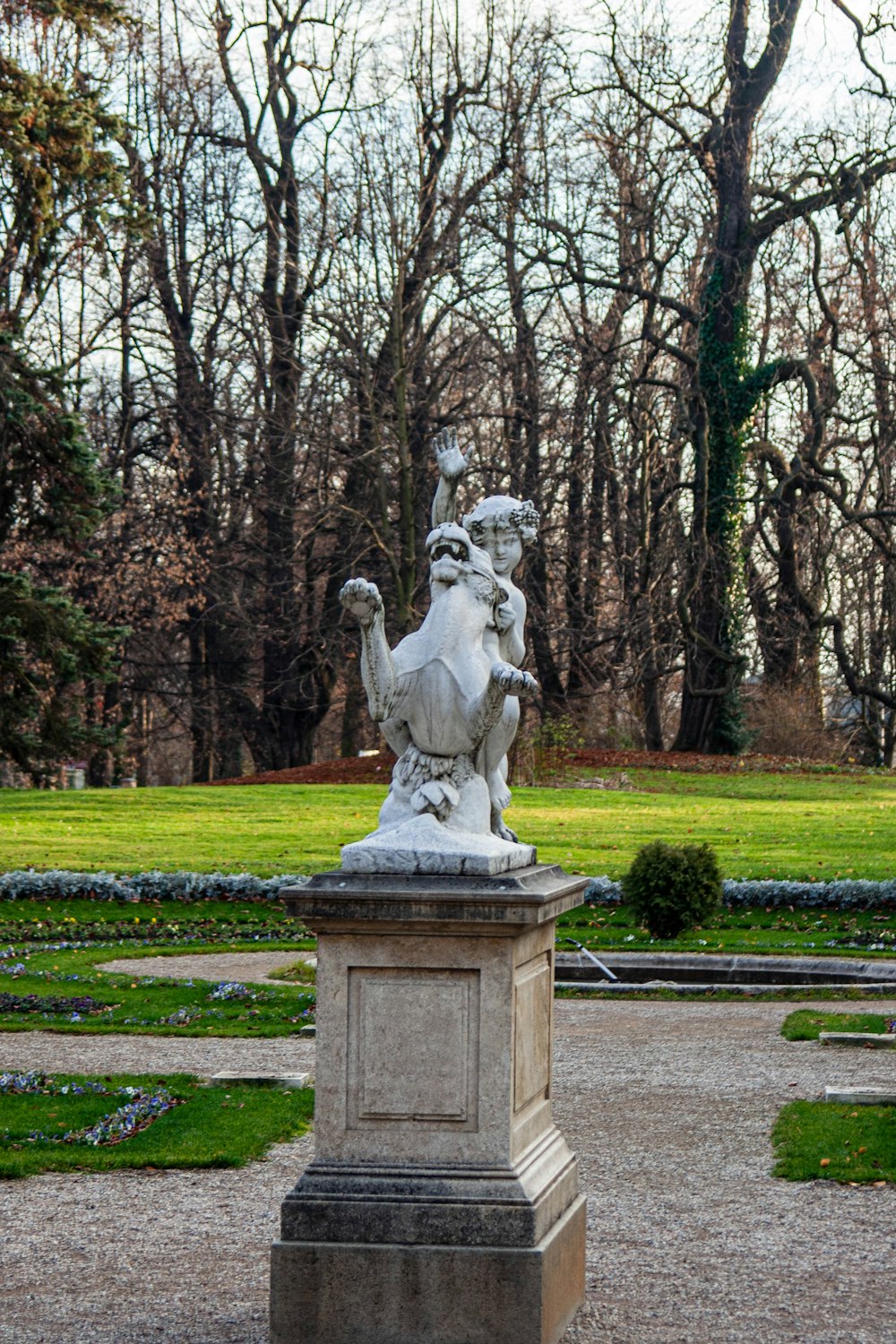 a statue of a man riding a horse in a park