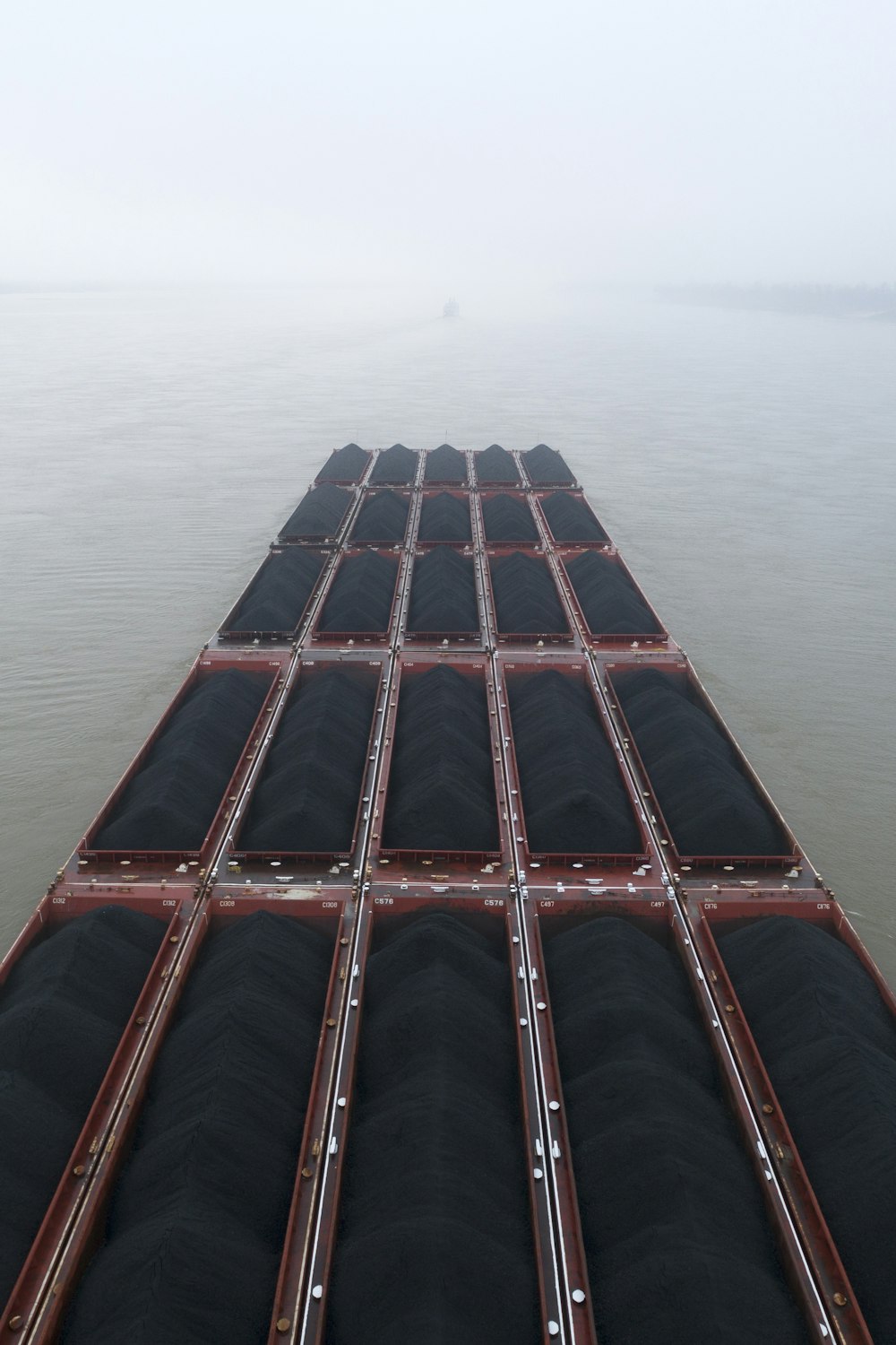 a large cargo ship in the middle of a body of water