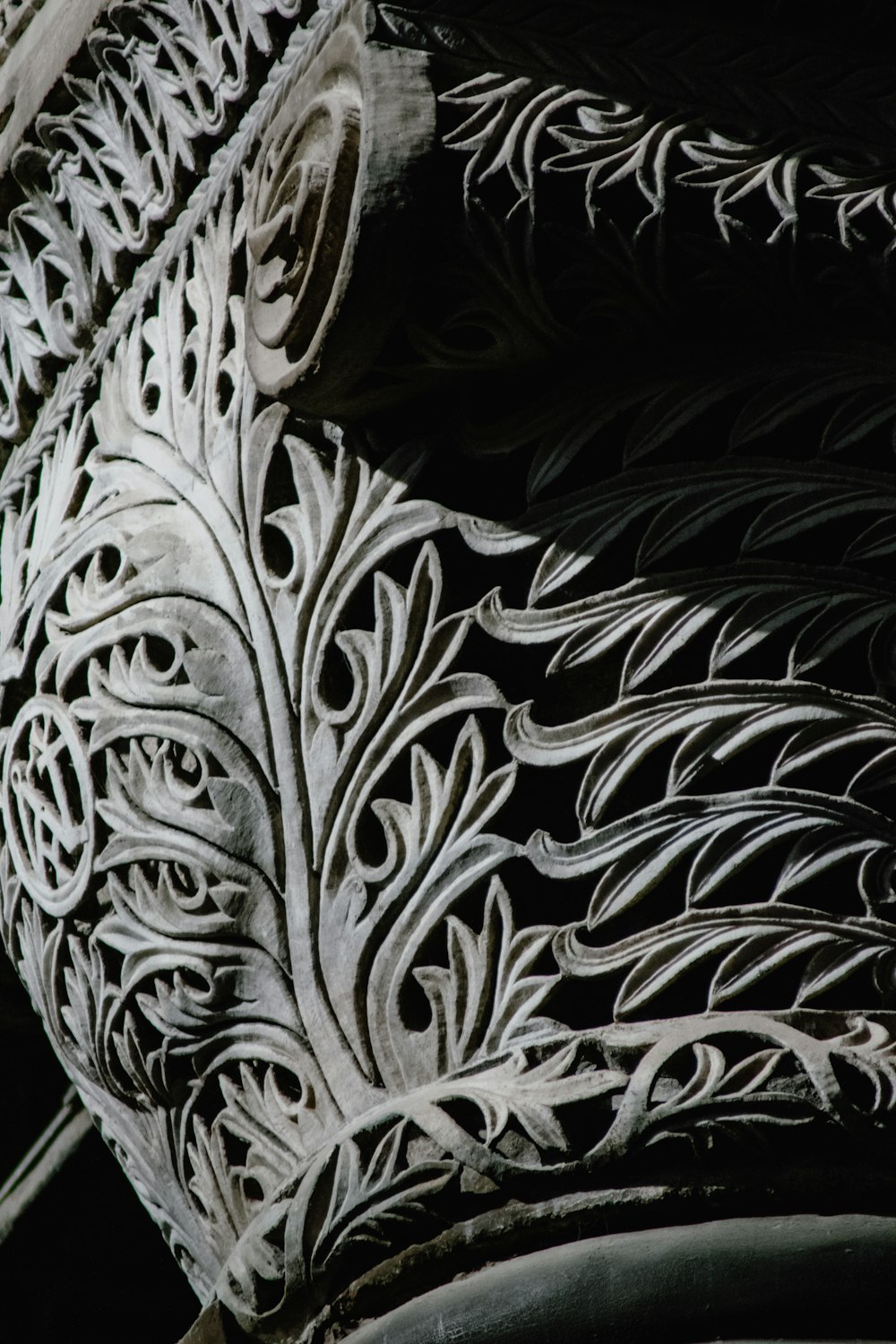 a close up of a decorative object on the side of a building