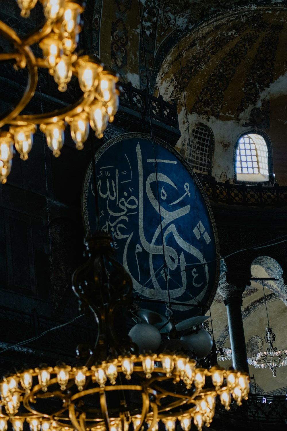 a chandelier hanging from the ceiling of a building