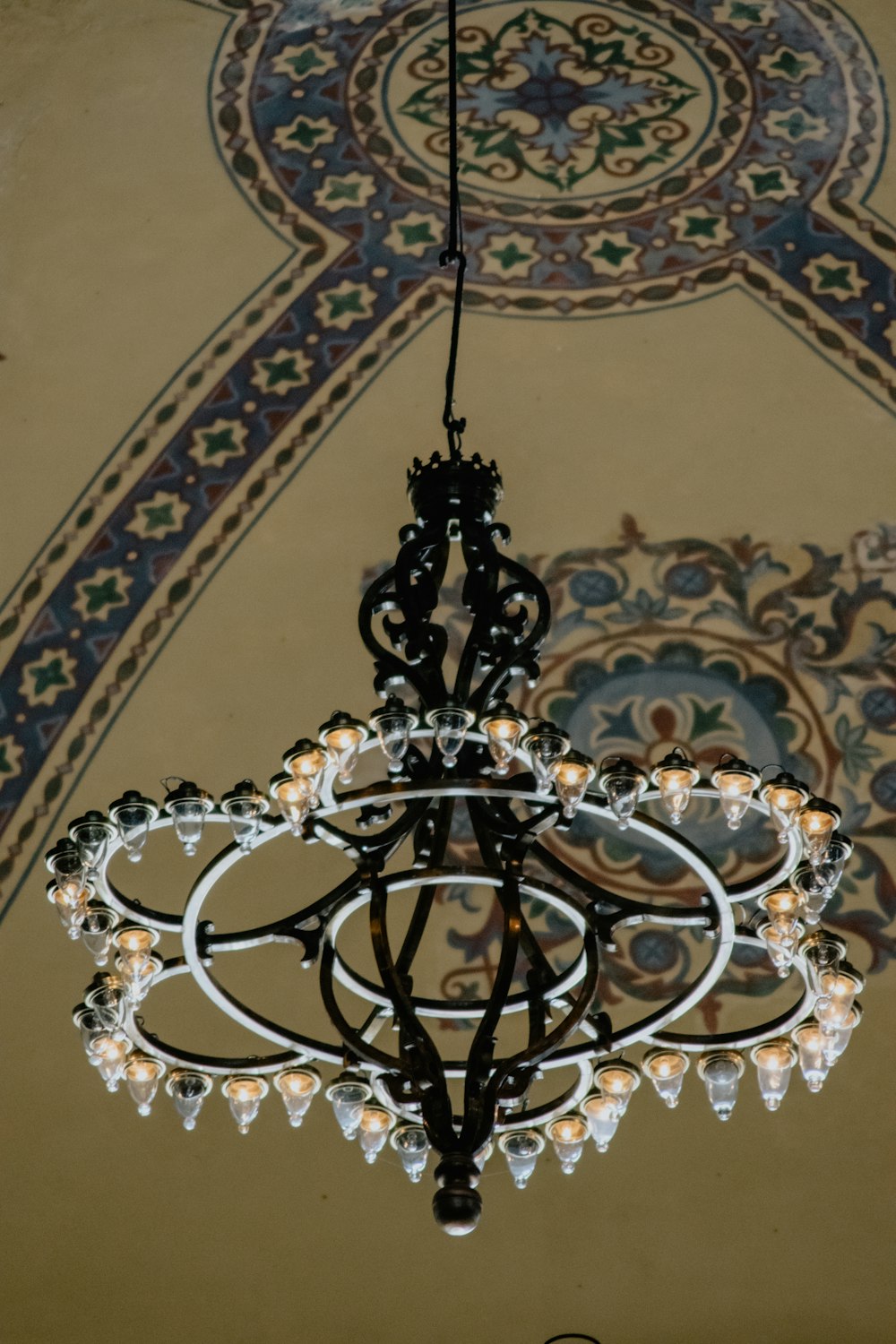 a chandelier hanging from a ceiling in a room