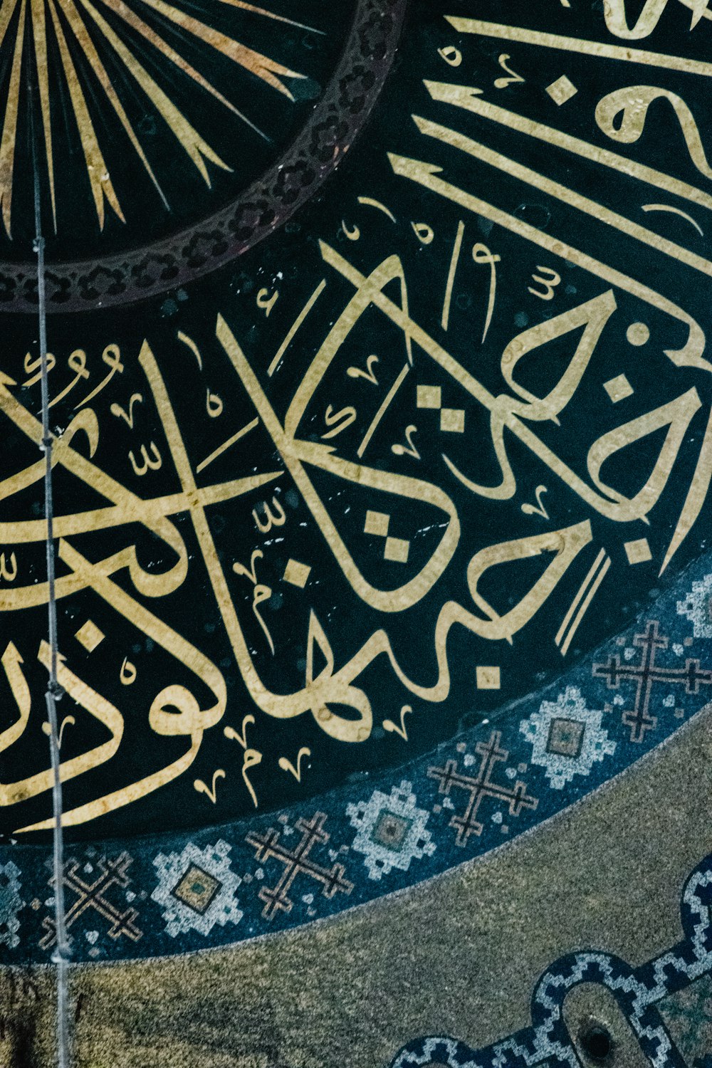 a close up of a calligraphy on a wall