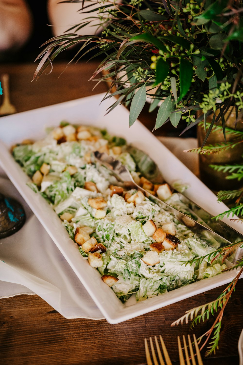 a tray of food sitting on top of a wooden table