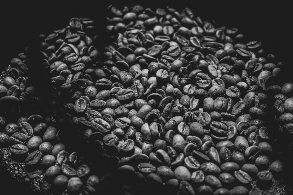 a pile of coffee beans sitting on top of a table