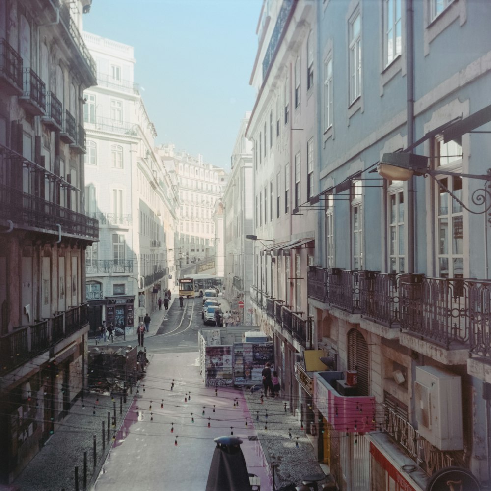 a city street filled with lots of tall buildings