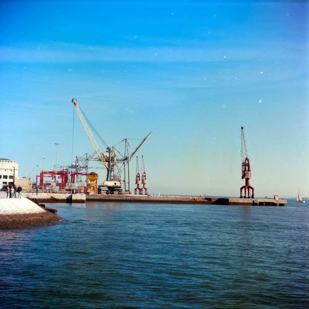 a large crane sitting on top of a body of water