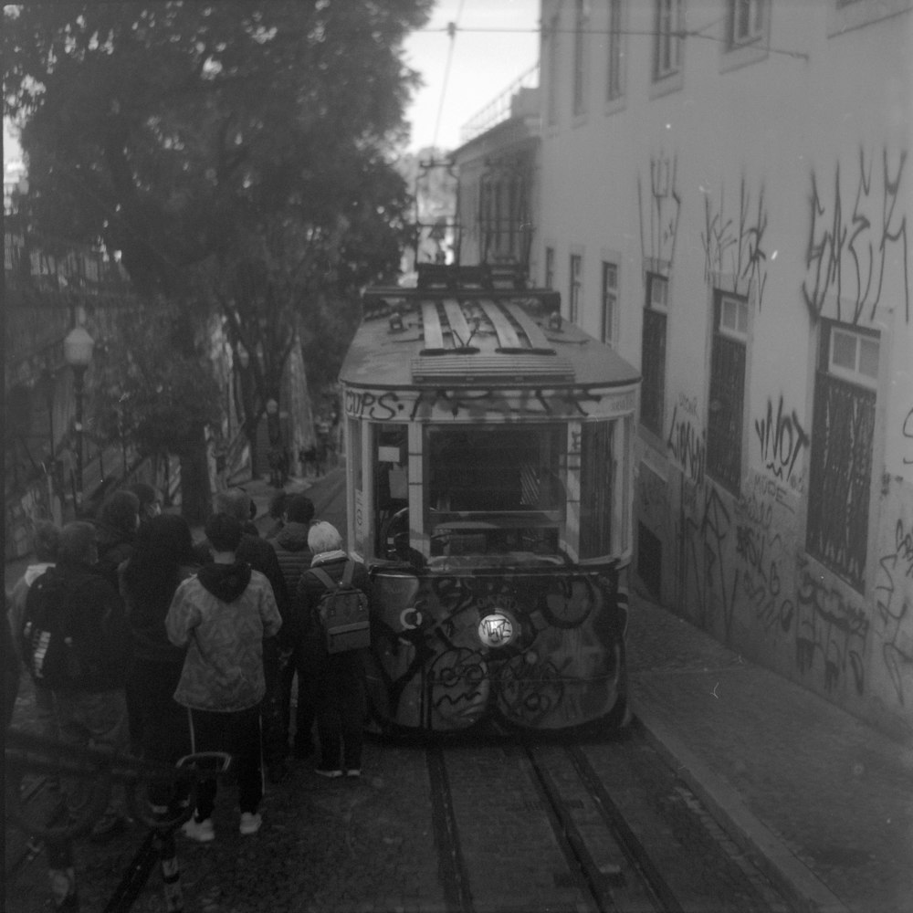 a black and white photo of a trolley car