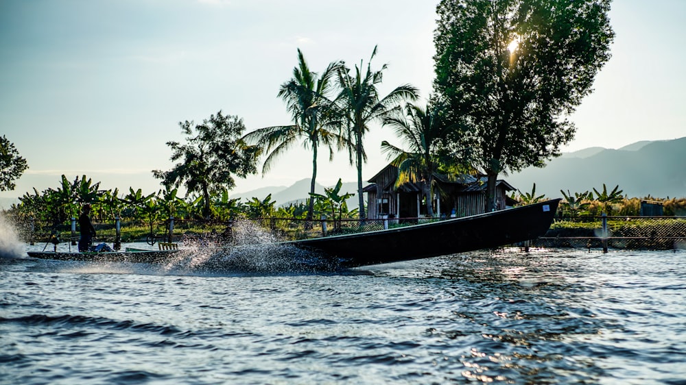 a boat with a house on top of it in the water