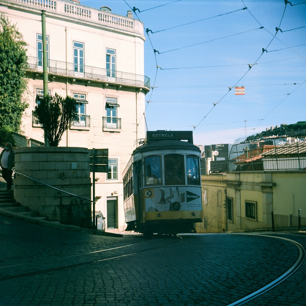 a train is going down the tracks near a building