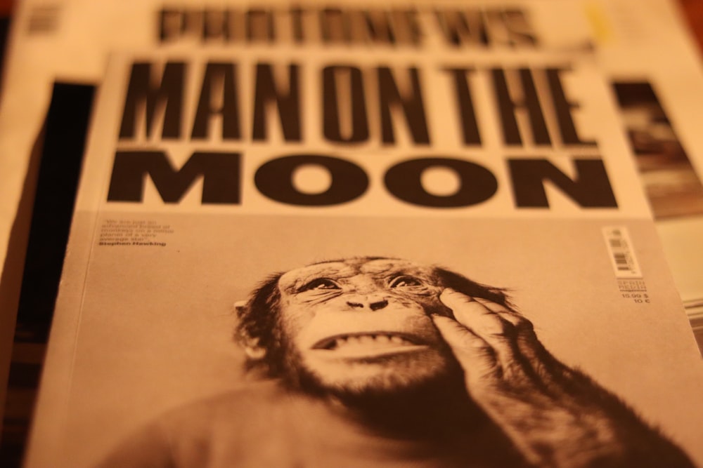 a close up of a newspaper with a monkey on it