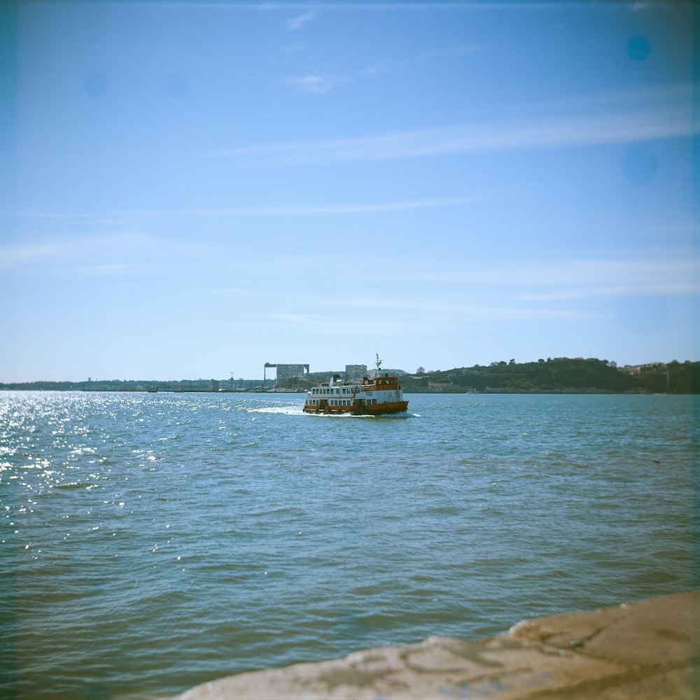 a boat traveling across a large body of water