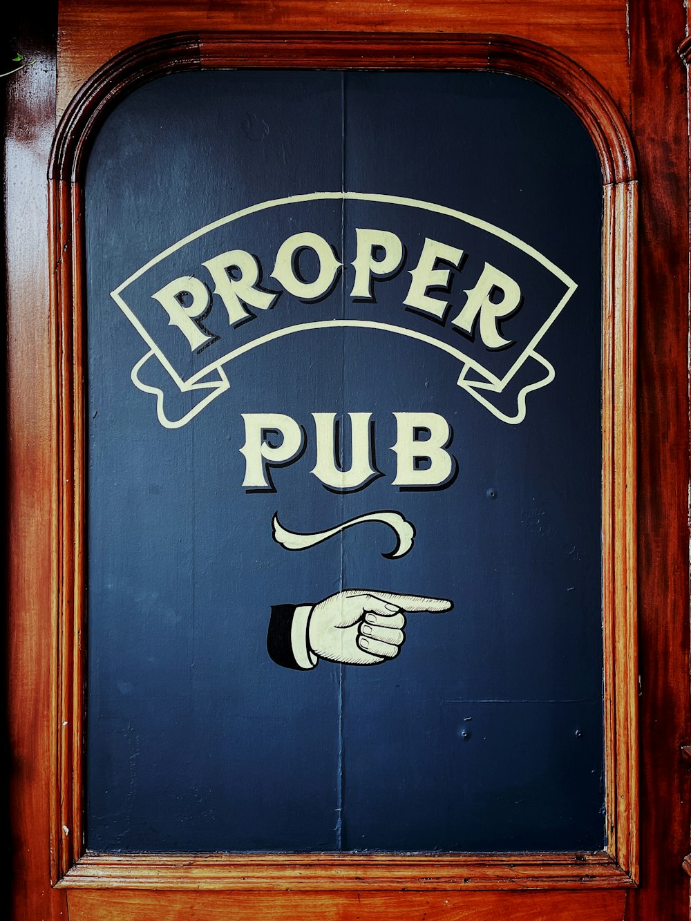 a wooden sign that says proper pub on it