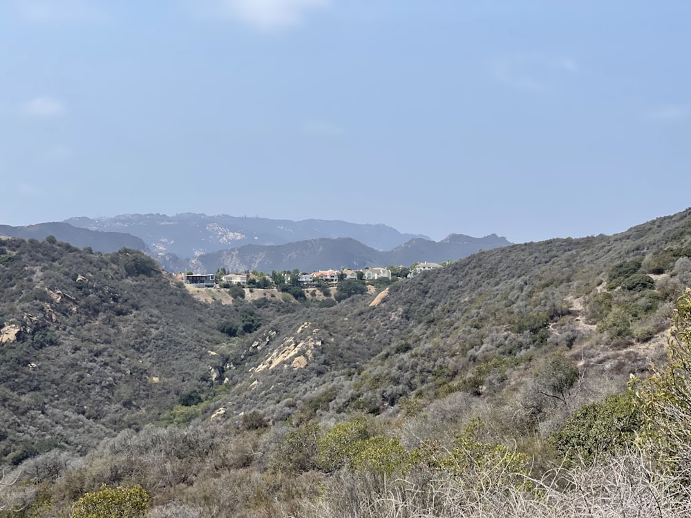 a view of the mountains and houses in the distance