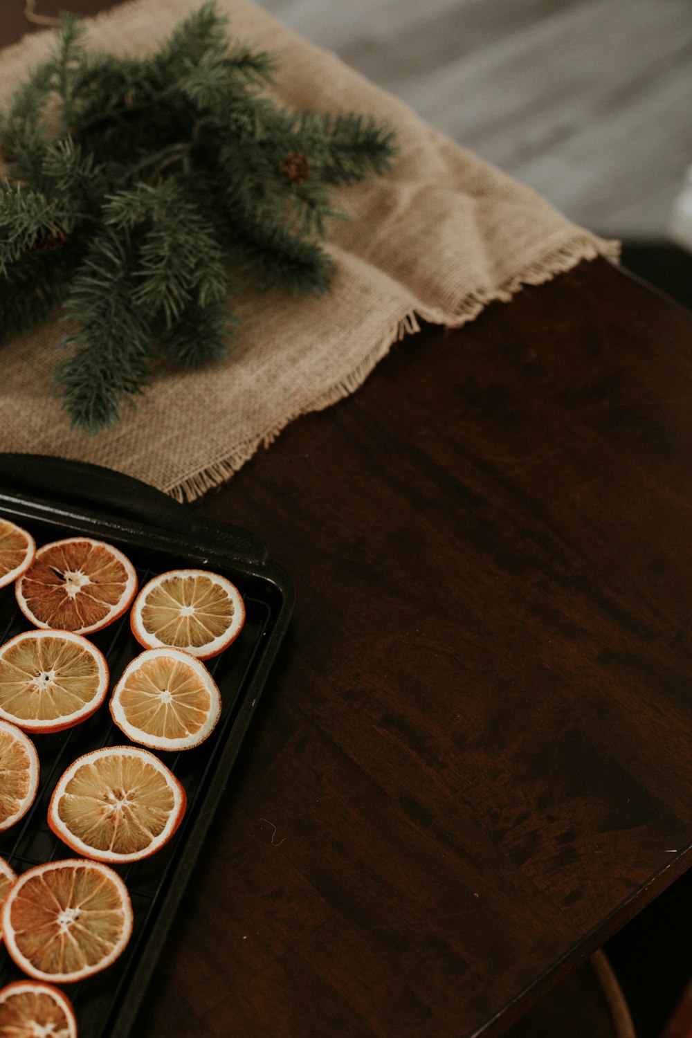 a tray of sliced oranges sitting on a table