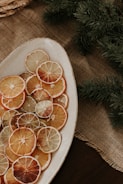 a plate of sliced oranges on a table