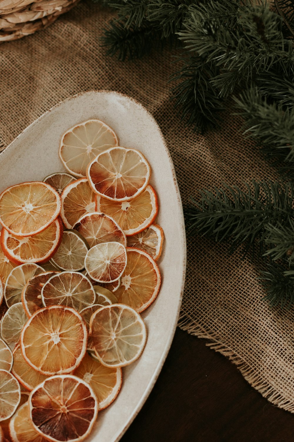 a plate of sliced oranges on a table