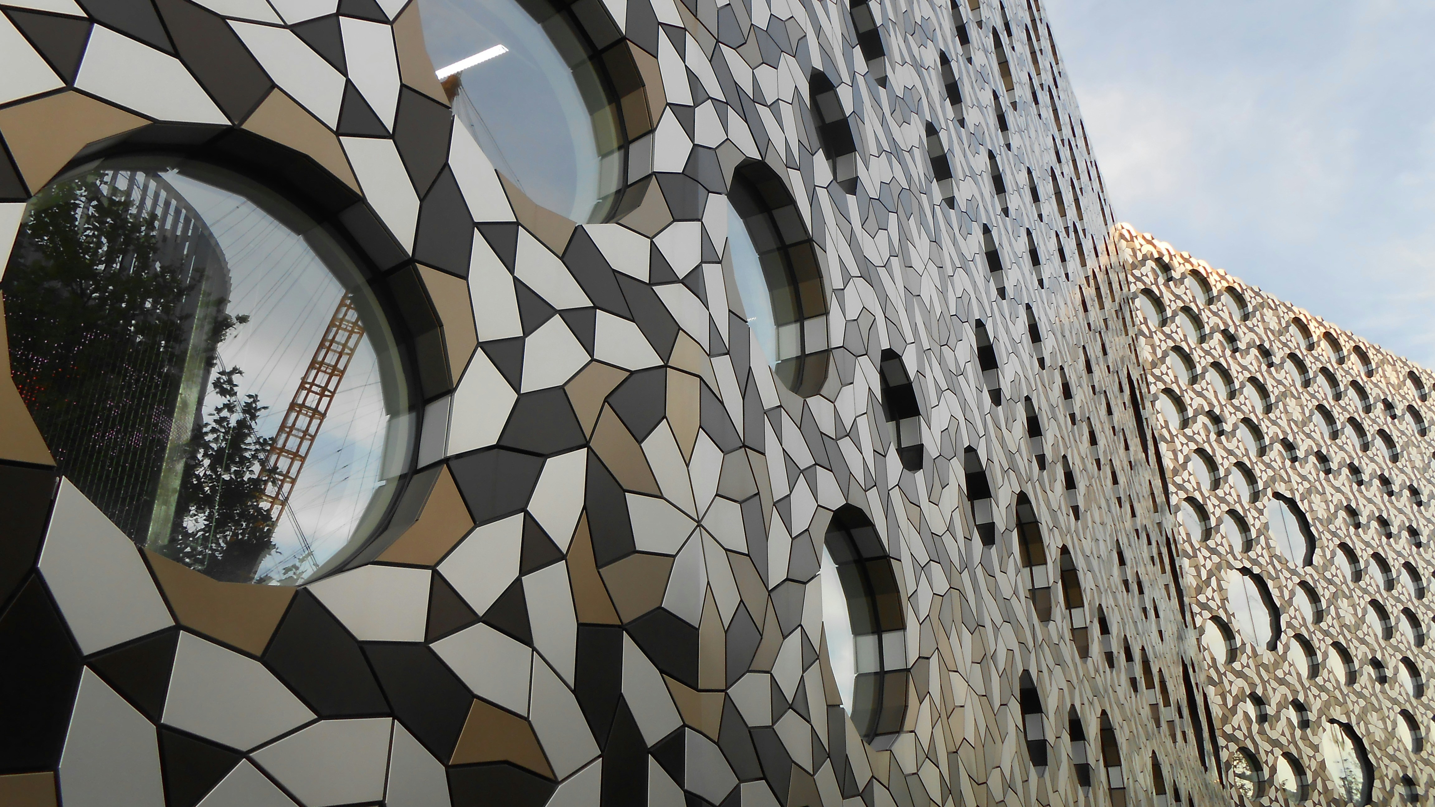 a close up of a building with circular windows