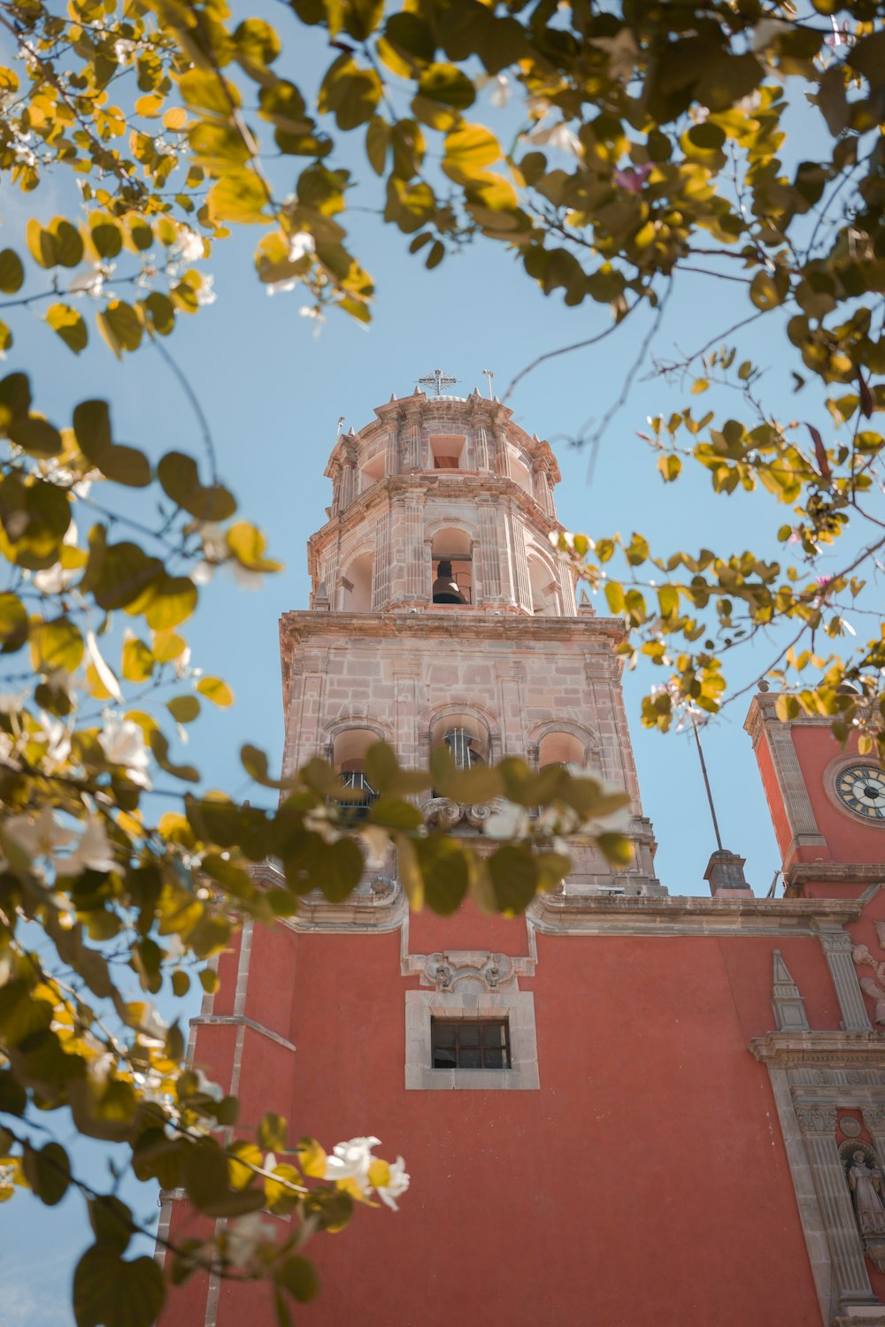 a tall tower with a clock on the top of it