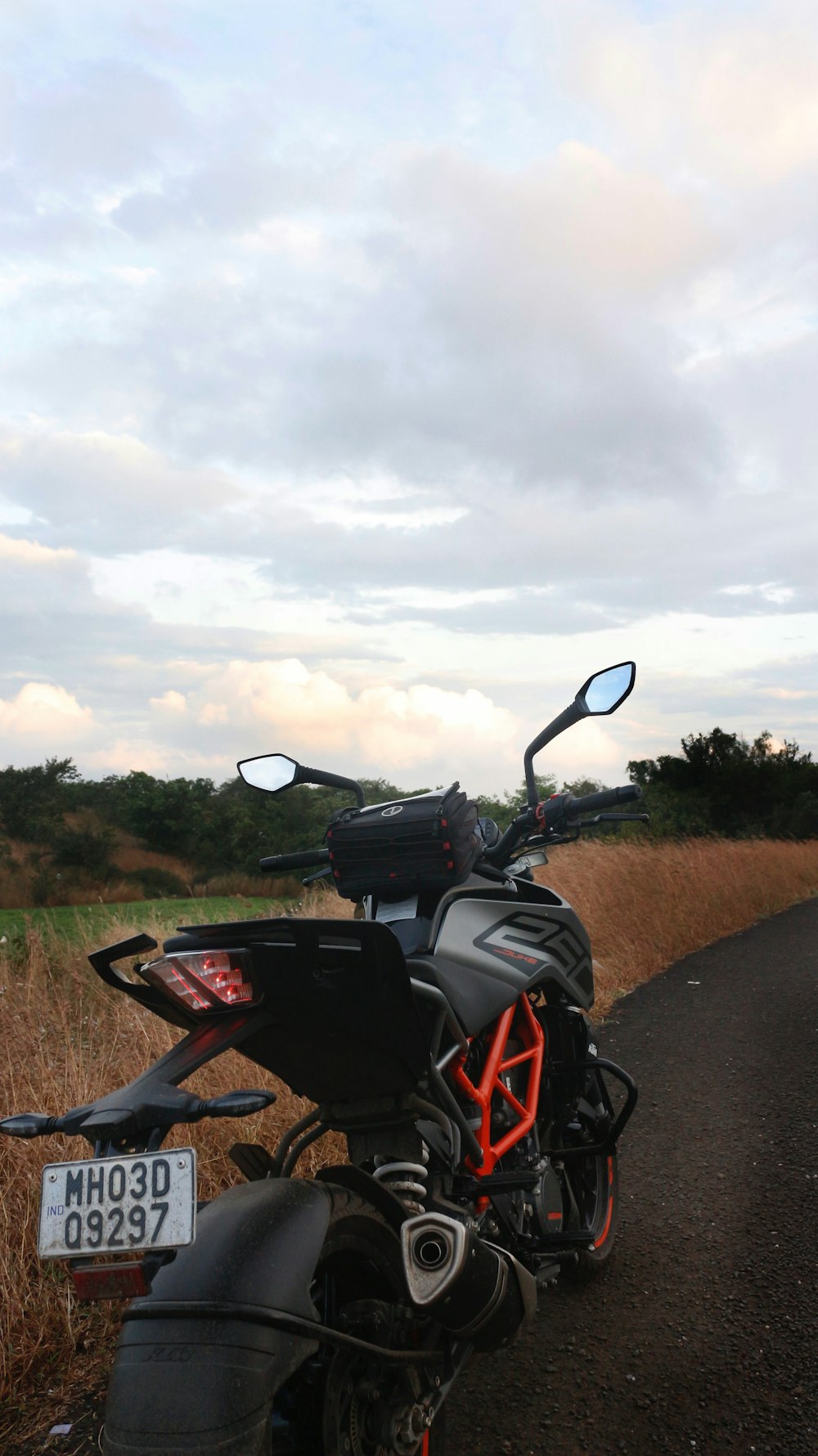 a motorcycle parked on the side of a road