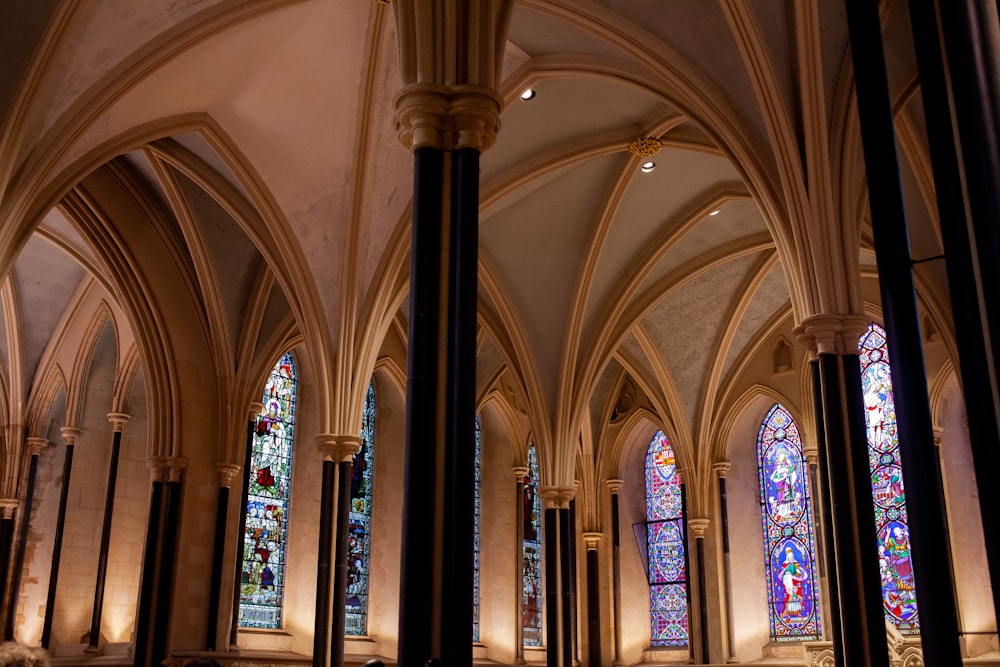 a cathedral with stained glass windows and columns