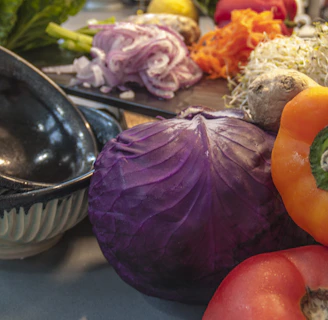 An assortment of fresh fruits and vegetables displayed on a modern kitchen counter, ready to be enjoyed.