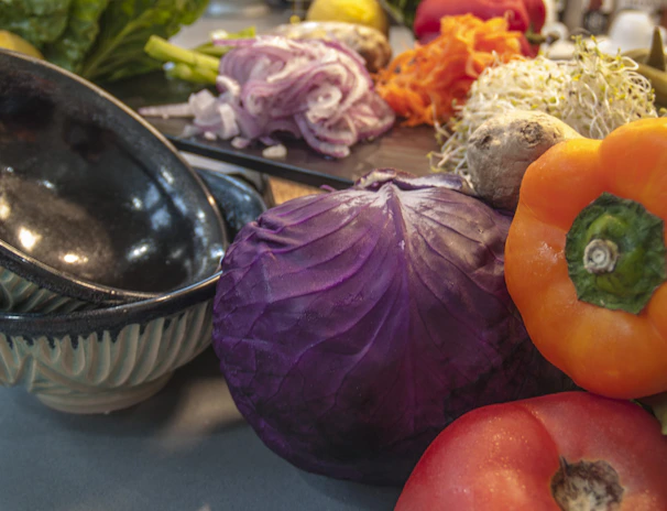 An assortment of fresh fruits and vegetables displayed on a modern kitchen counter, ready to be enjoyed.