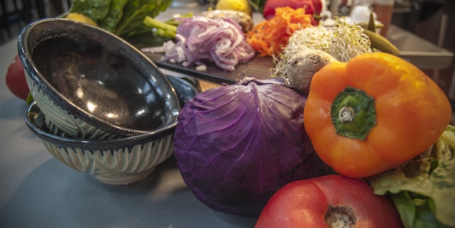 A vibrant kitchen scene with fresh ingredients and prepared meals ready for serving.