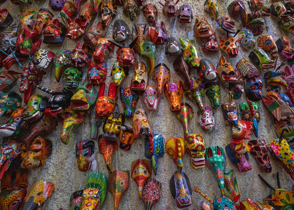 a bunch of colorful shoes that are on the ground