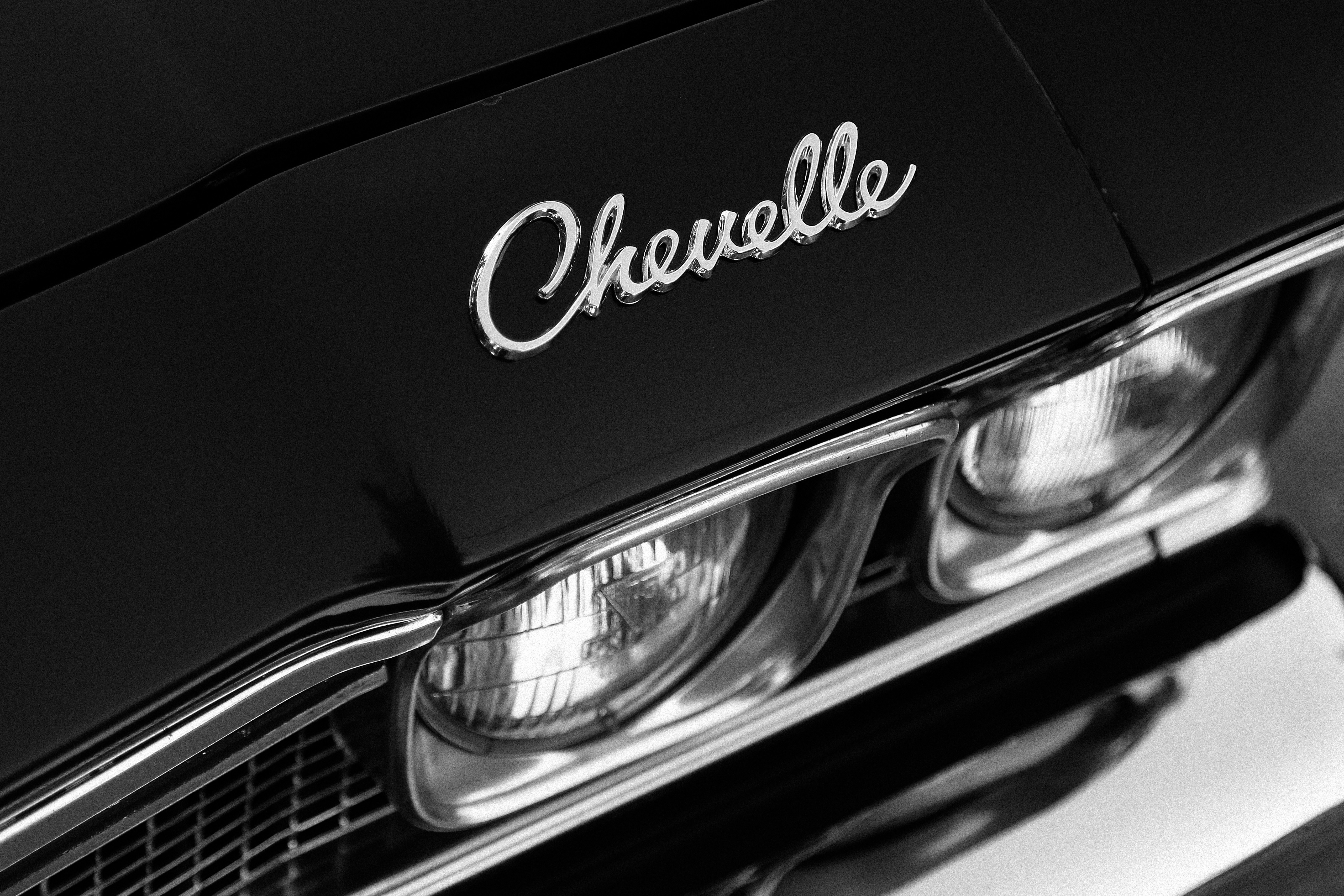 a close up of the front of a classic car