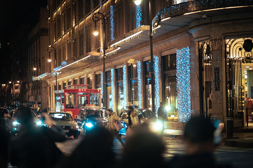 a city street filled with lots of traffic at night