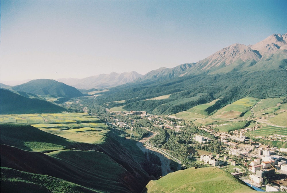 a scenic view of a valley and mountains