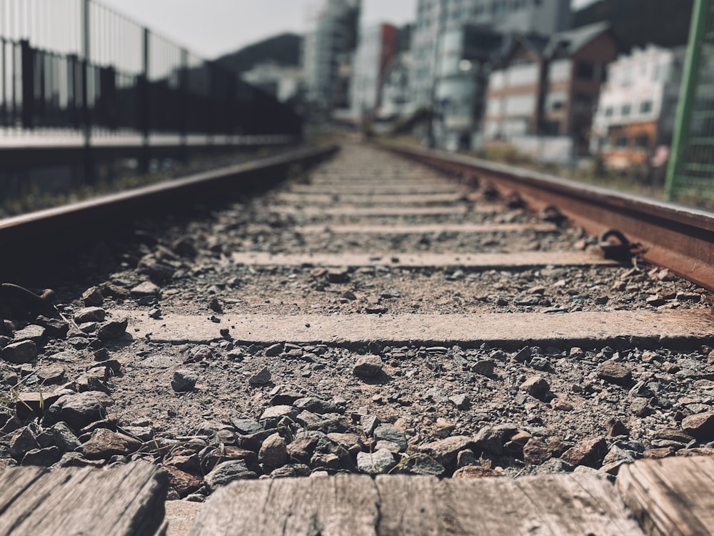 a train track with a few rocks on it