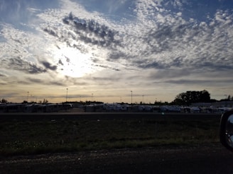 A wide shot of the RV park’s paved roads and spacious lots under a bright blue sky.