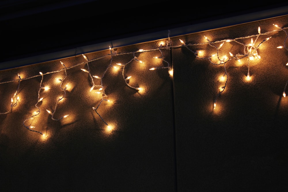 a bunch of lights that are on a wall