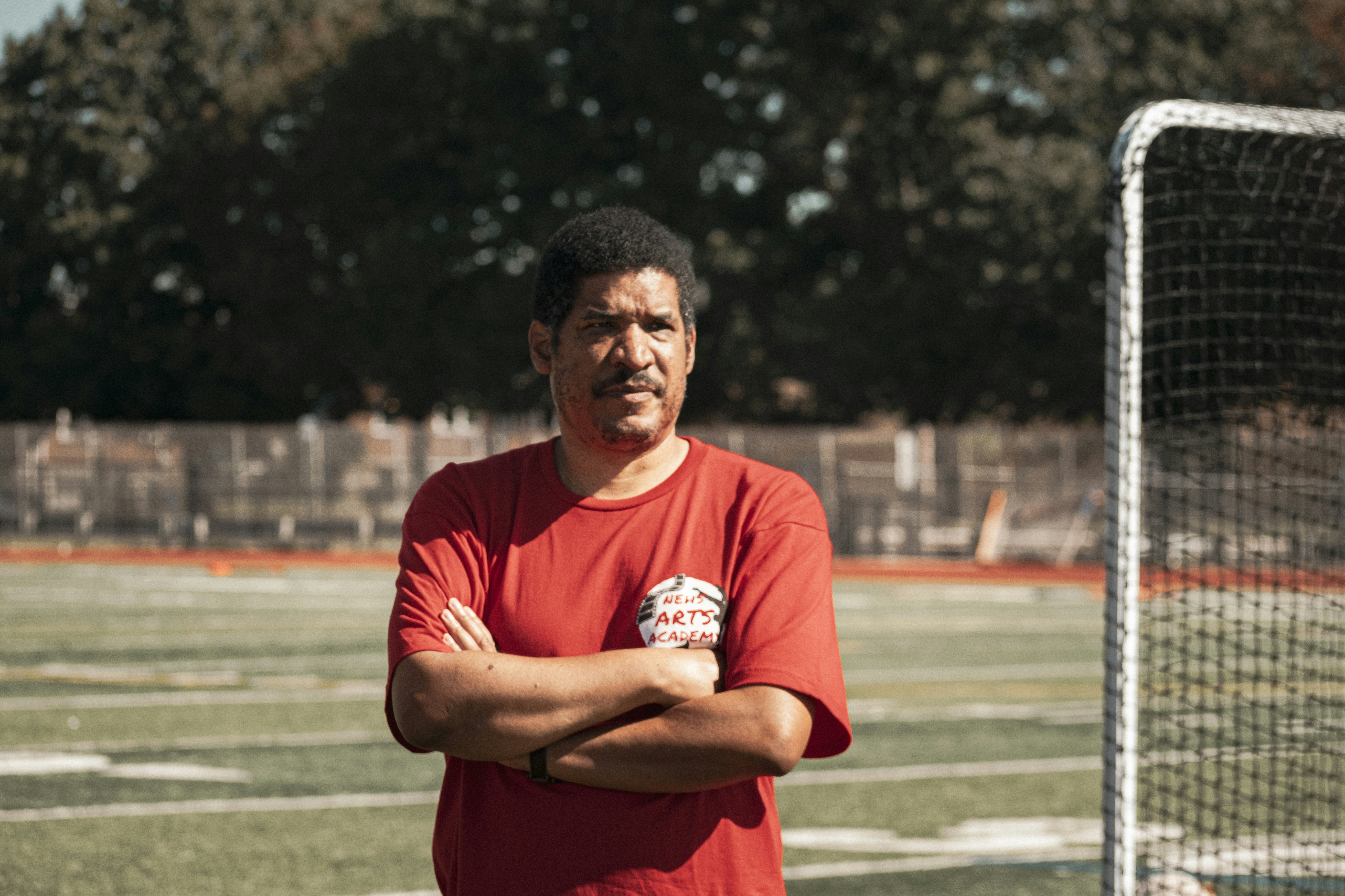 a man standing in front of a soccer goal