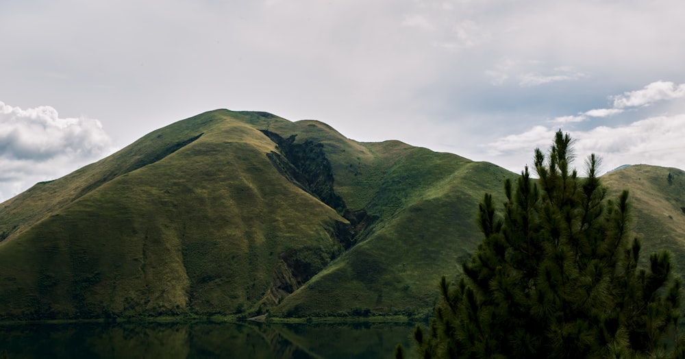 a mountain range with a body of water in front of it