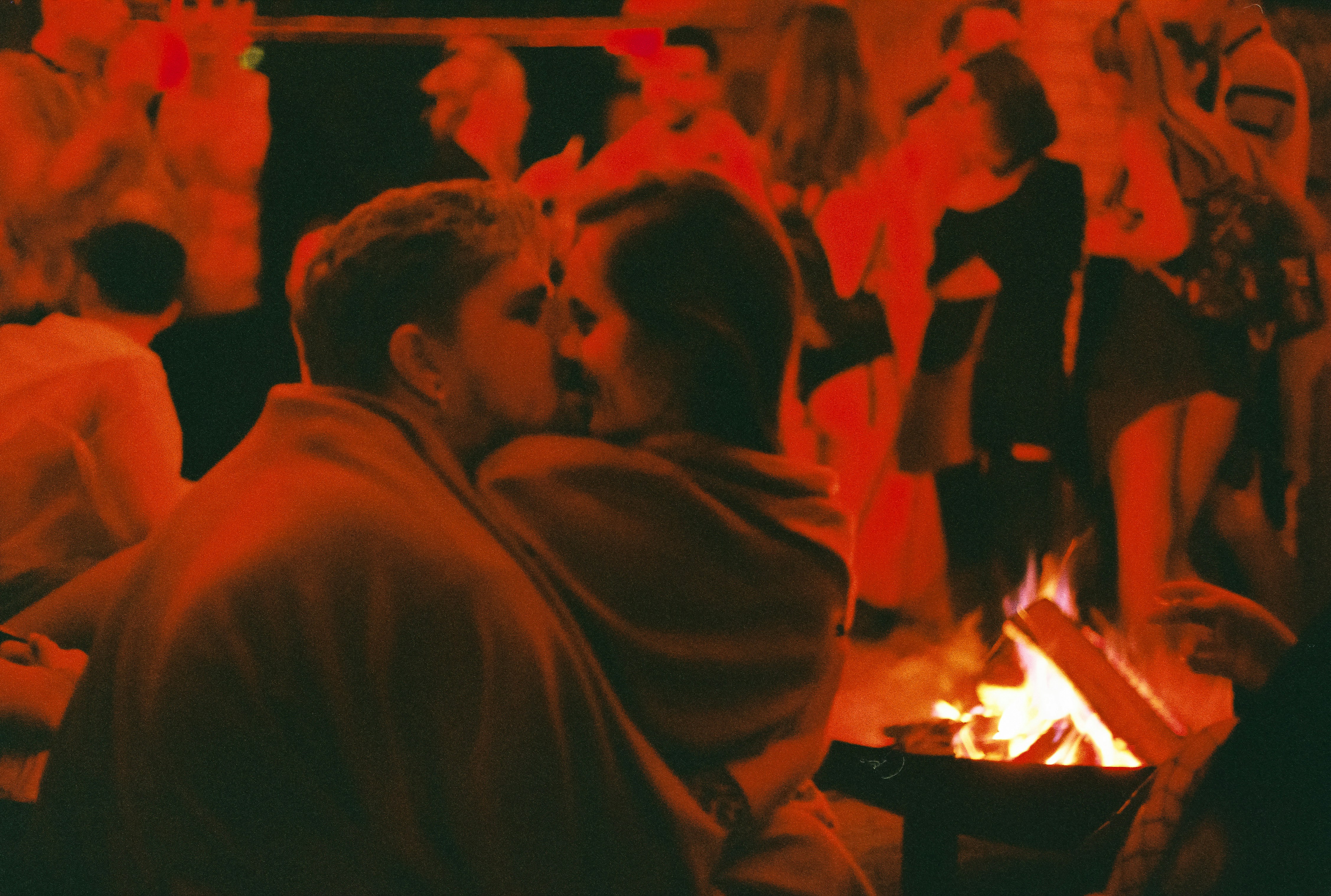 Residents socializing in a stylish communal lounge with a fireplace. - high rise apartments near me