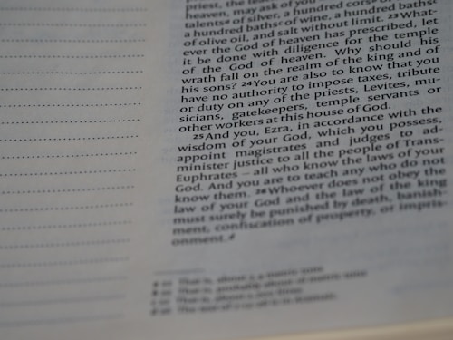 A close-up view of a page from a book, featuring text aligned to the right. The text appears to be a passage discussing historical or religious themes, seemingly from a religious or literary work. The page includes lines of text with varying font sizes and style differences.