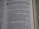 A close-up view of a page from a book containing text. The text is presented in a neat, column format with numbered lists and section headings highlighted in bold. The focus appears to be on specific words and phrases related to family heads and descendants.