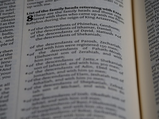 A close-up view of a page from a book containing text. The text is presented in a neat, column format with numbered lists and section headings highlighted in bold. The focus appears to be on specific words and phrases related to family heads and descendants.