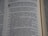 A close-up view of a page from a book containing text. The text is presented in a neat, column format with numbered lists and section headings highlighted in bold. The focus appears to be on specific words and phrases related to family heads and descendants.