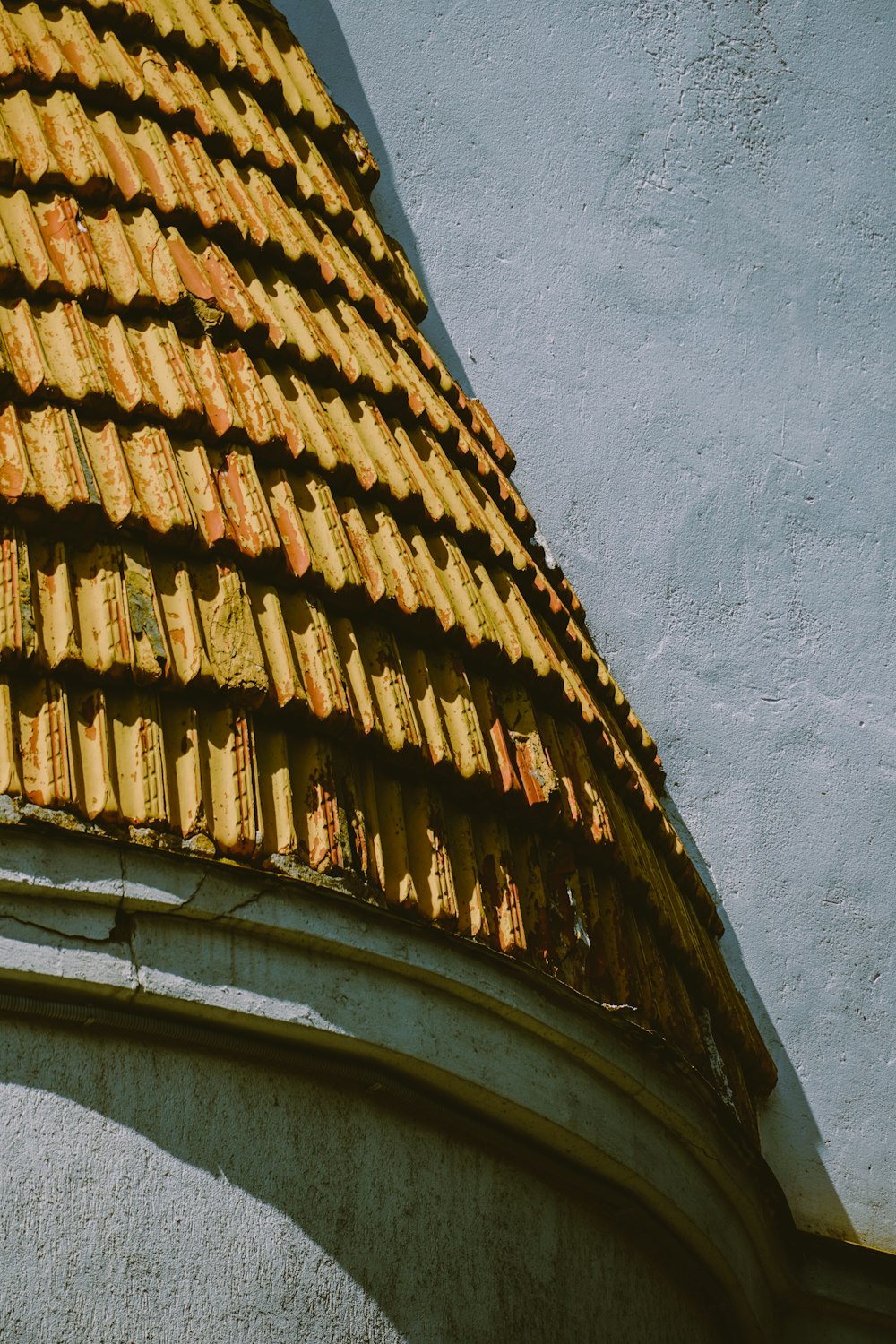 a close up of a roof with a clock on it