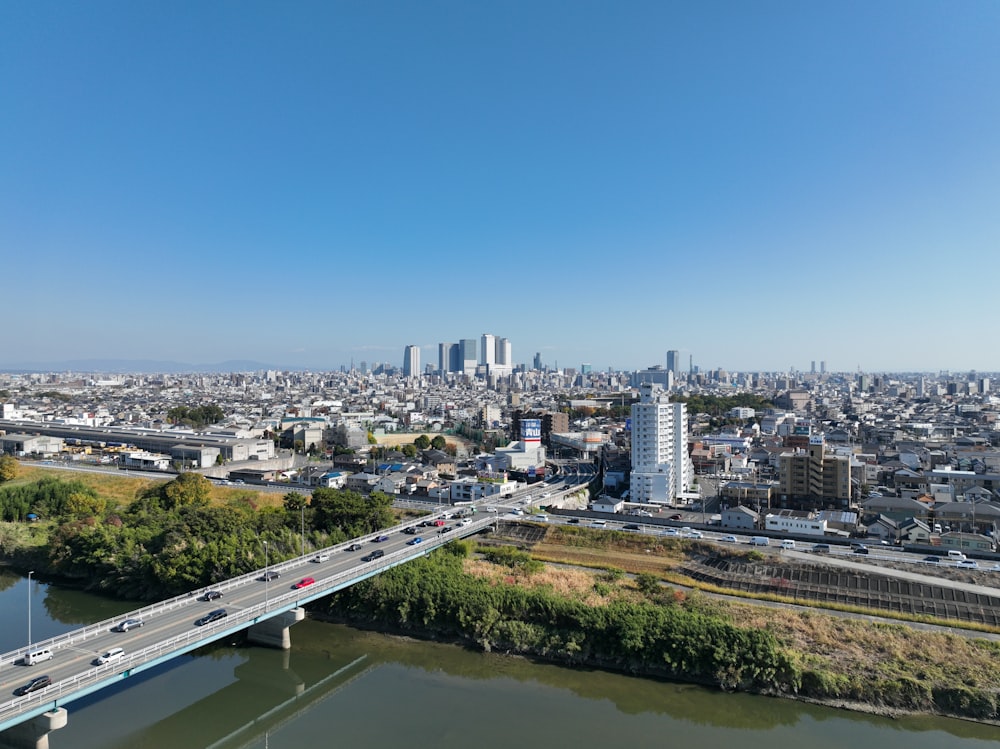 a view of a city and a bridge over a river