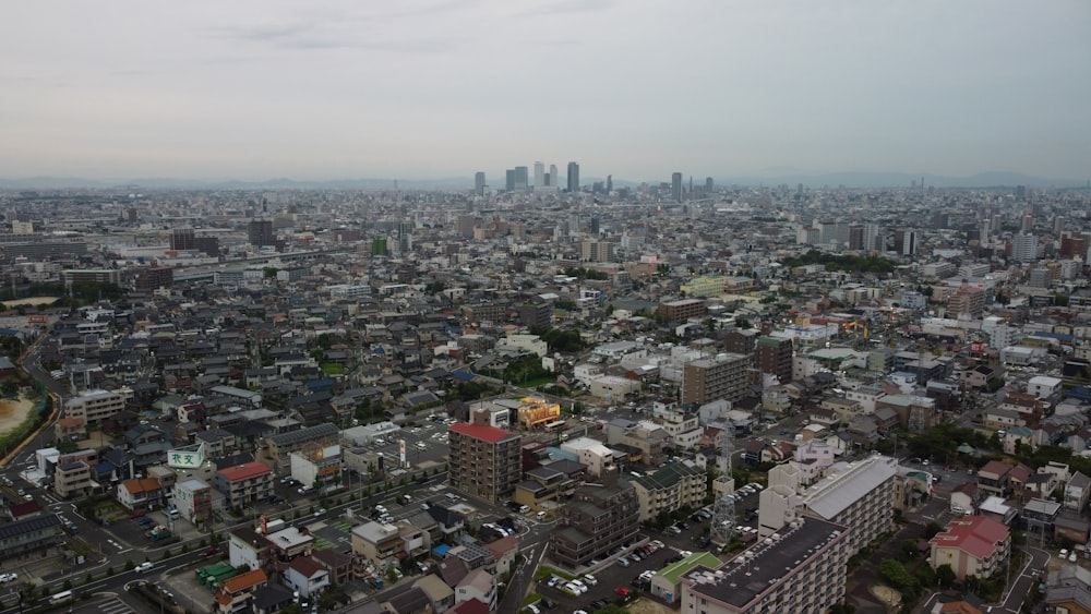 an aerial view of a city with tall buildings